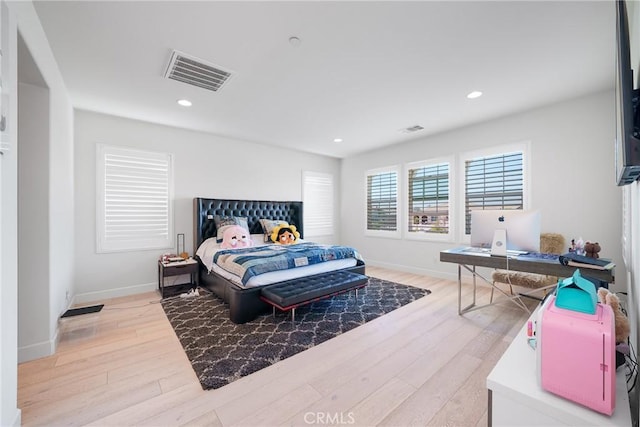 bedroom with light wood-type flooring