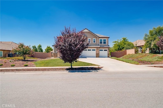 view of front of property with a garage and a front yard