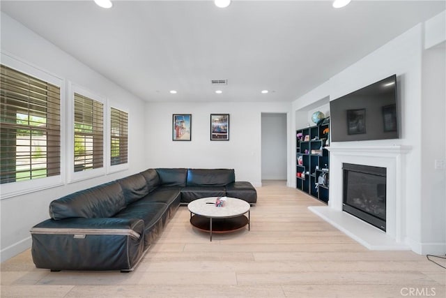 living room with light hardwood / wood-style floors