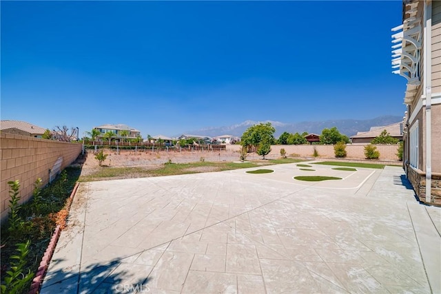 view of patio / terrace featuring a mountain view