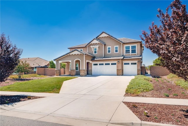 craftsman inspired home with a front yard and a garage