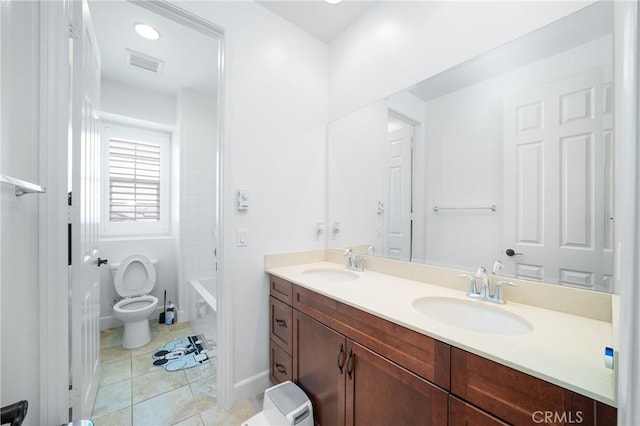 full bathroom featuring tile patterned floors, vanity, toilet, and shower / tub combination