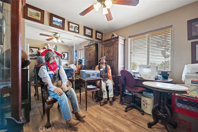 home office featuring ceiling fan and hardwood / wood-style flooring