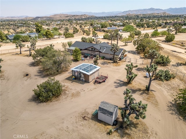 birds eye view of property with a mountain view