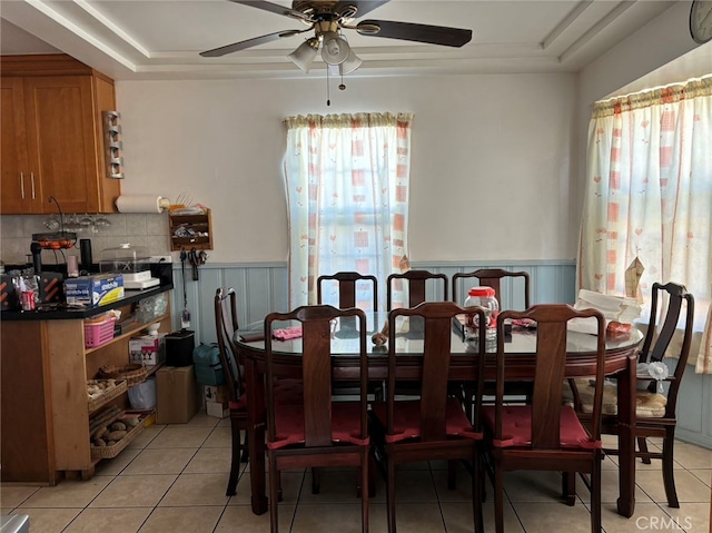 dining space featuring light tile patterned floors and a healthy amount of sunlight