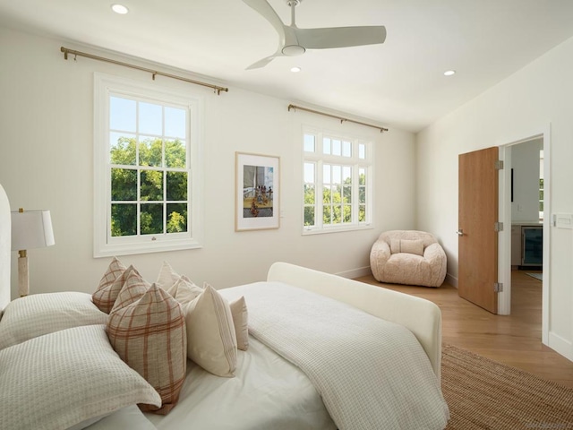 bedroom featuring ceiling fan and light hardwood / wood-style flooring