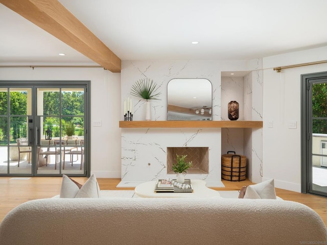 living room featuring hardwood / wood-style flooring, french doors, and beamed ceiling