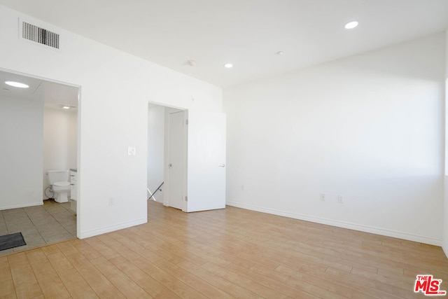 unfurnished room featuring light wood-type flooring