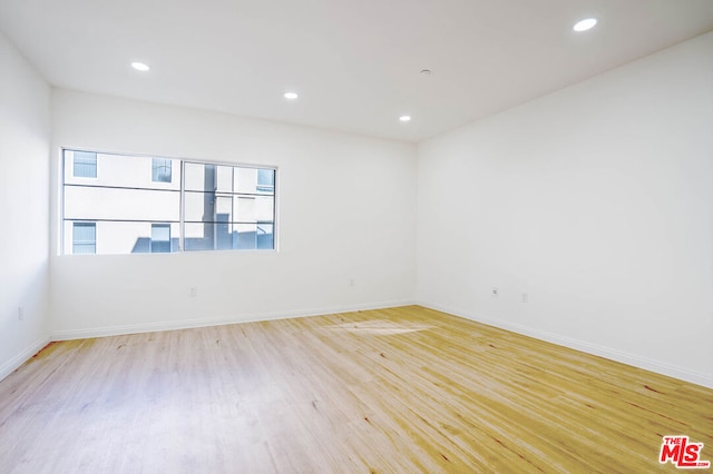 unfurnished room featuring light hardwood / wood-style floors