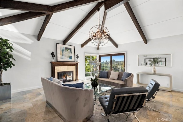 living room featuring a high end fireplace, beam ceiling, high vaulted ceiling, and an inviting chandelier