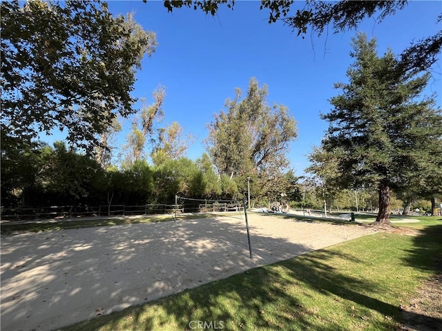 view of home's community featuring volleyball court