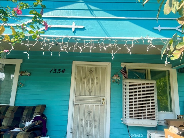 property entrance featuring central AC