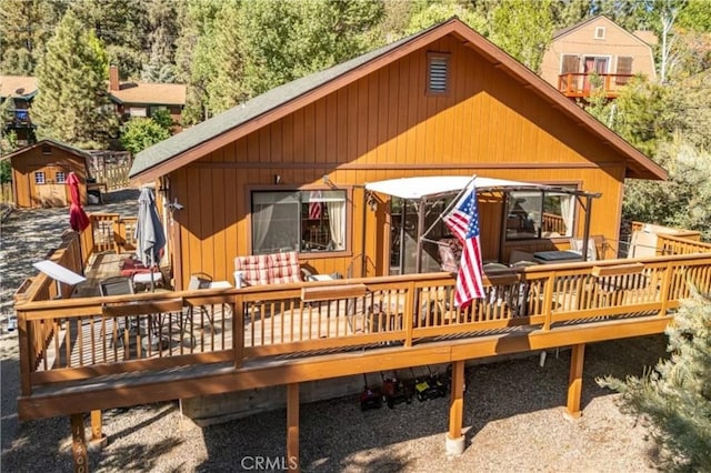 rear view of house with a deck