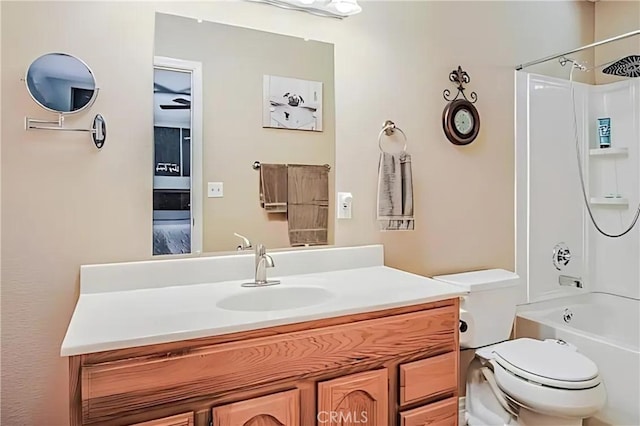 full bathroom featuring shower / washtub combination, vanity, and toilet