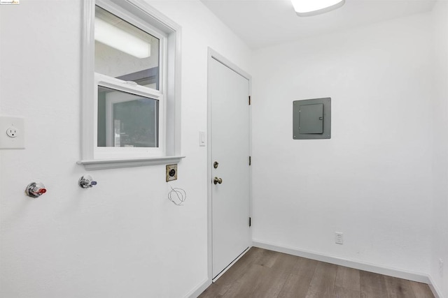 entryway with electric panel and light hardwood / wood-style floors