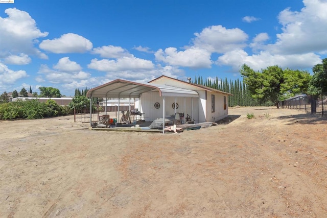 view of front of home with a carport