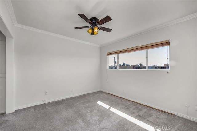 carpeted empty room with crown molding and ceiling fan