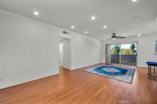 interior space with crown molding, light hardwood / wood-style floors, and ceiling fan