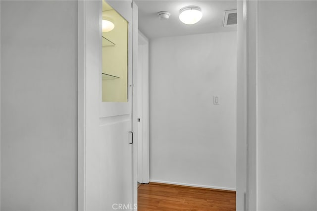 hallway featuring hardwood / wood-style flooring