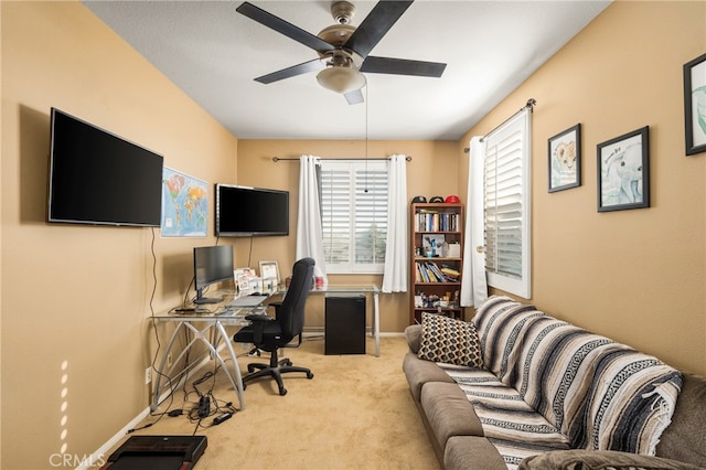 office with ceiling fan and light colored carpet