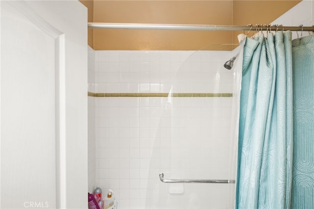 bathroom featuring a shower with curtain