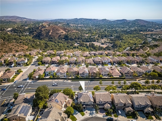 birds eye view of property featuring a mountain view