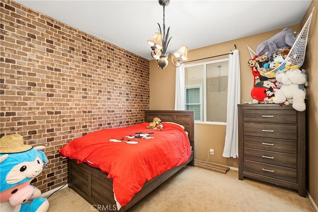 bedroom with brick wall, carpet, and a notable chandelier