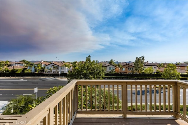 wooden terrace featuring a residential view