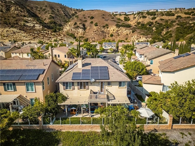 aerial view featuring a mountain view and a residential view