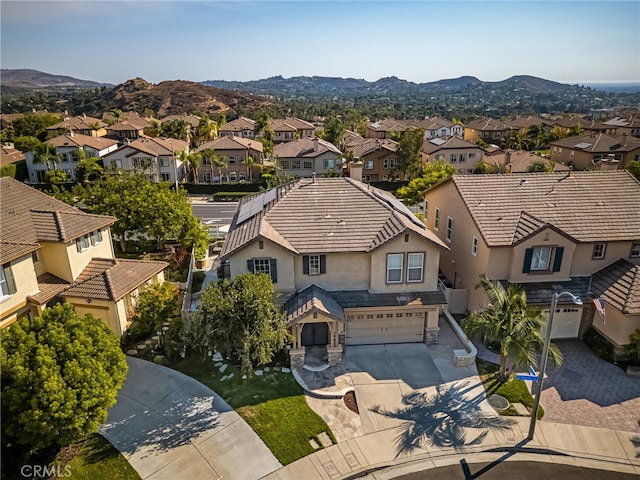 birds eye view of property with a mountain view