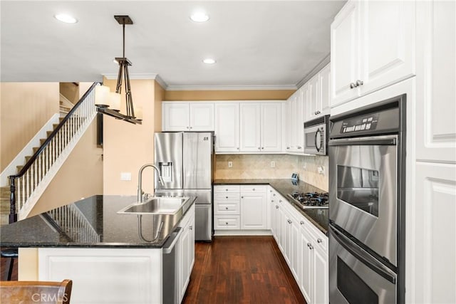 kitchen featuring crown molding, a sink, stainless steel appliances, white cabinetry, and dark wood-type flooring