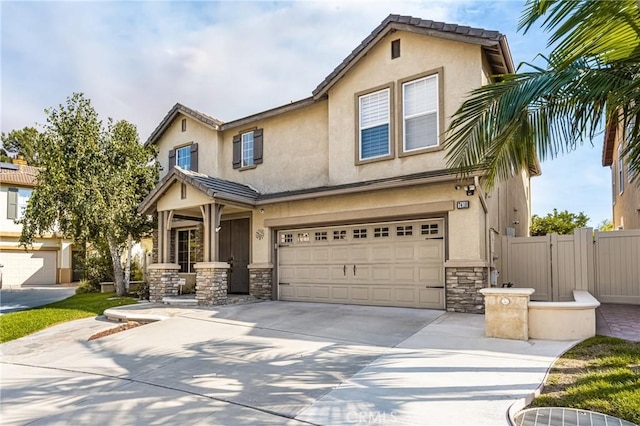 view of front facade with a garage, stone siding, stucco siding, and fence