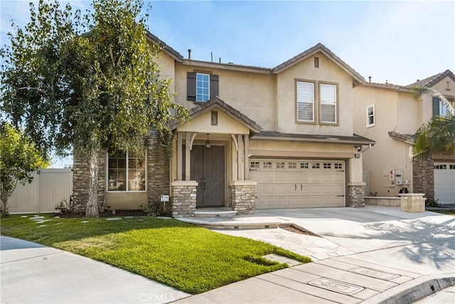 view of front of house featuring a garage and a front lawn