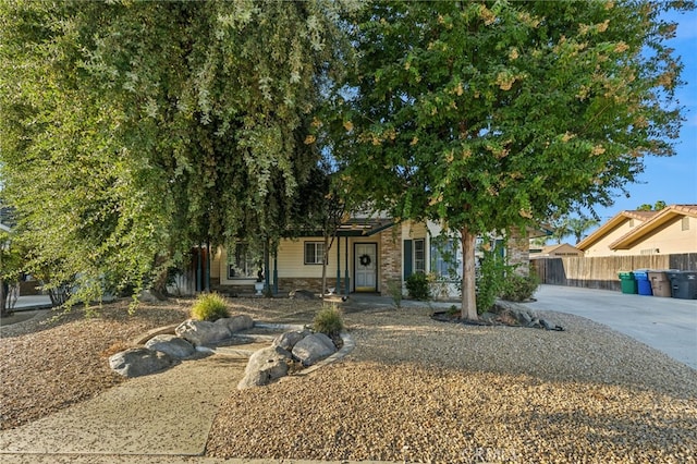 view of property hidden behind natural elements