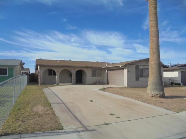 ranch-style home featuring a garage