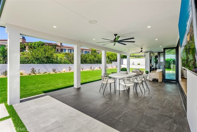 sunroom / solarium with ceiling fan