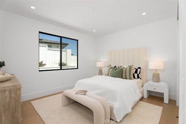 bedroom with light wood-type flooring