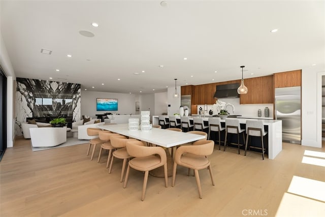 dining area featuring light wood-type flooring