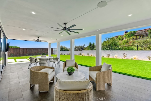 view of patio with ceiling fan and outdoor lounge area