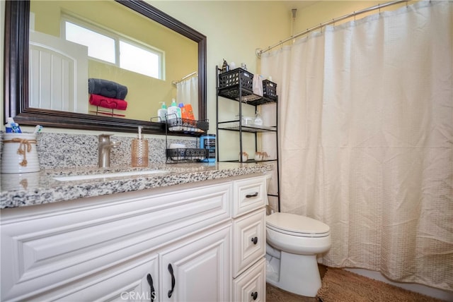 bathroom with vanity and toilet