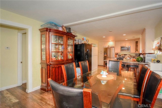 dining area with light wood-type flooring