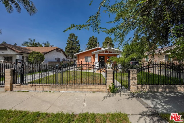 bungalow-style house with a front lawn