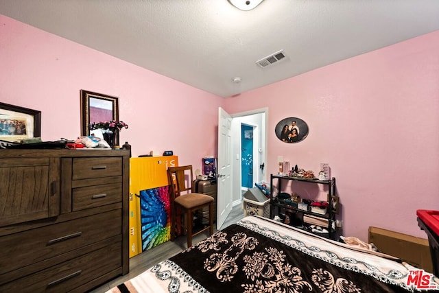 bedroom featuring light hardwood / wood-style flooring