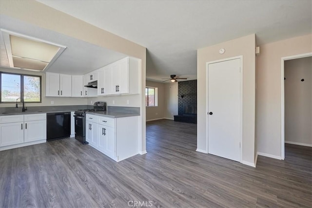 kitchen featuring dark hardwood / wood-style floors, white cabinetry, black dishwasher, sink, and stainless steel gas range