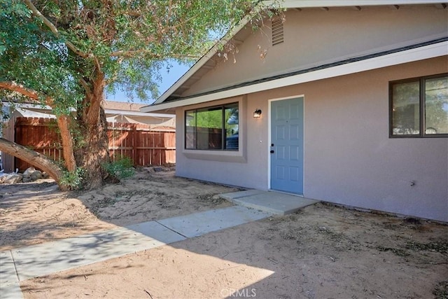 doorway to property featuring a patio