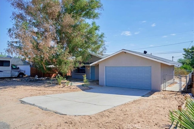 ranch-style home featuring a garage