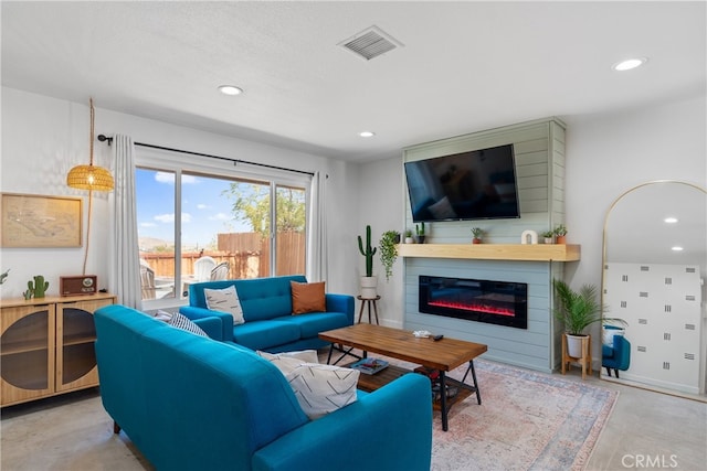 living room with a textured ceiling