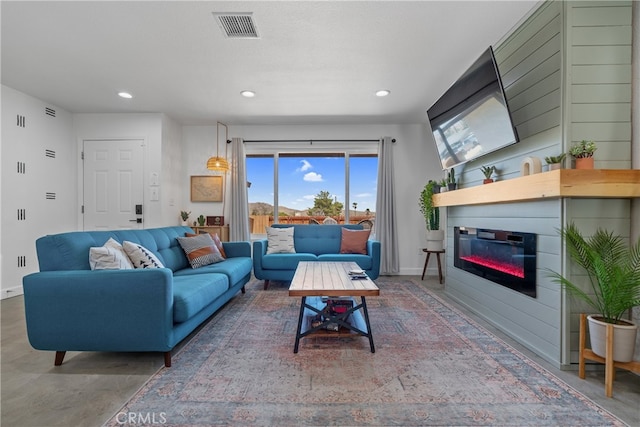 living room featuring concrete flooring