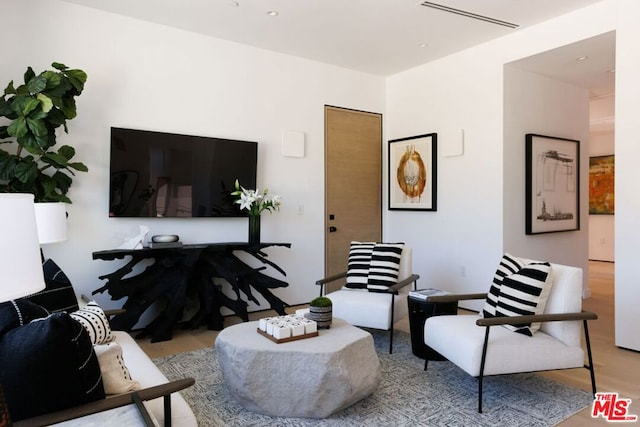 living room with light hardwood / wood-style flooring