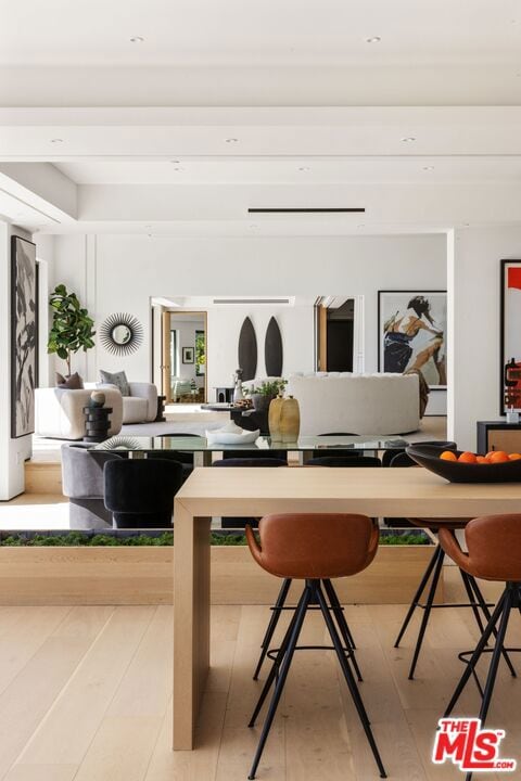 dining space with light hardwood / wood-style floors